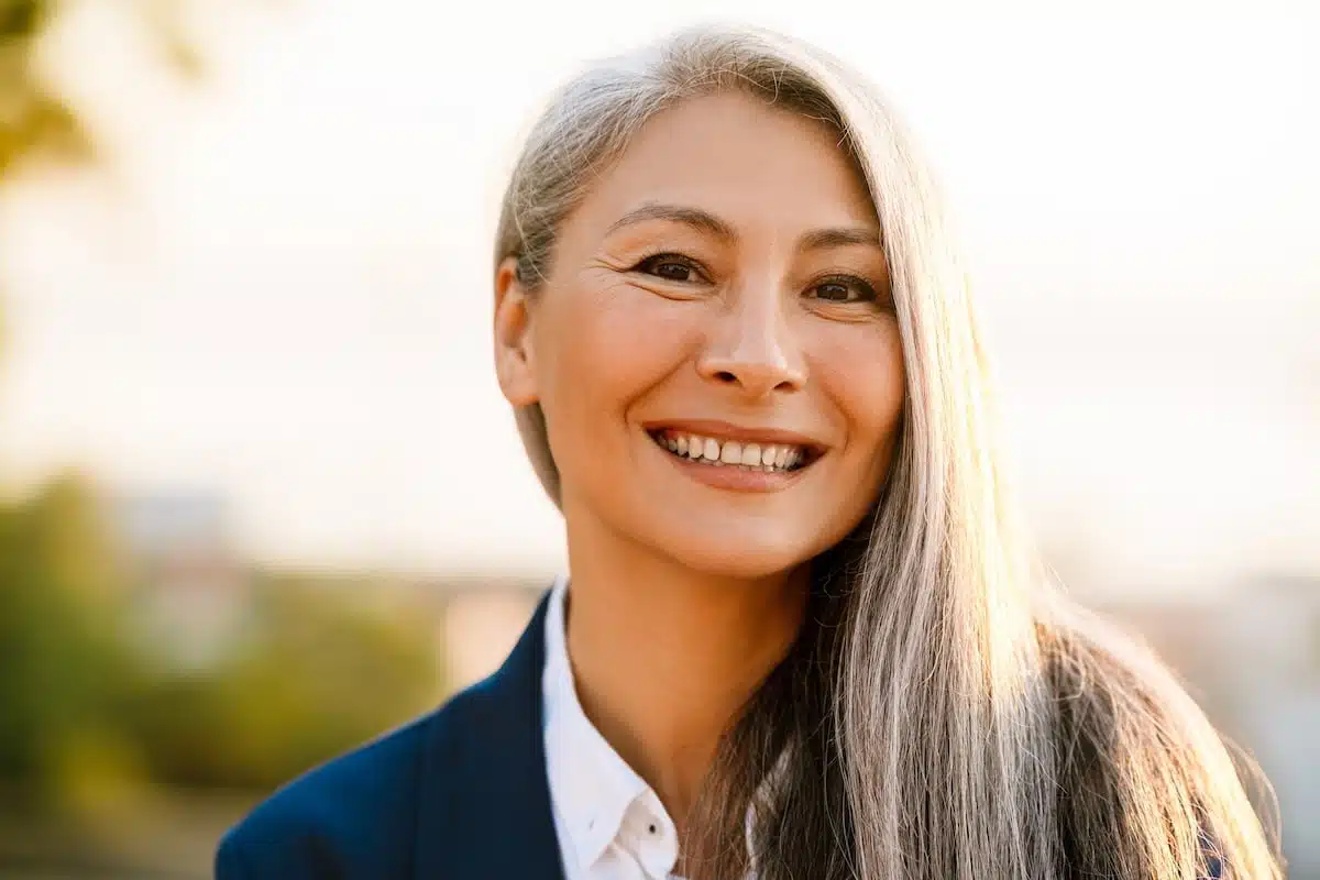 HRT Blog 44 Photo of an older woman smiling and walking outside